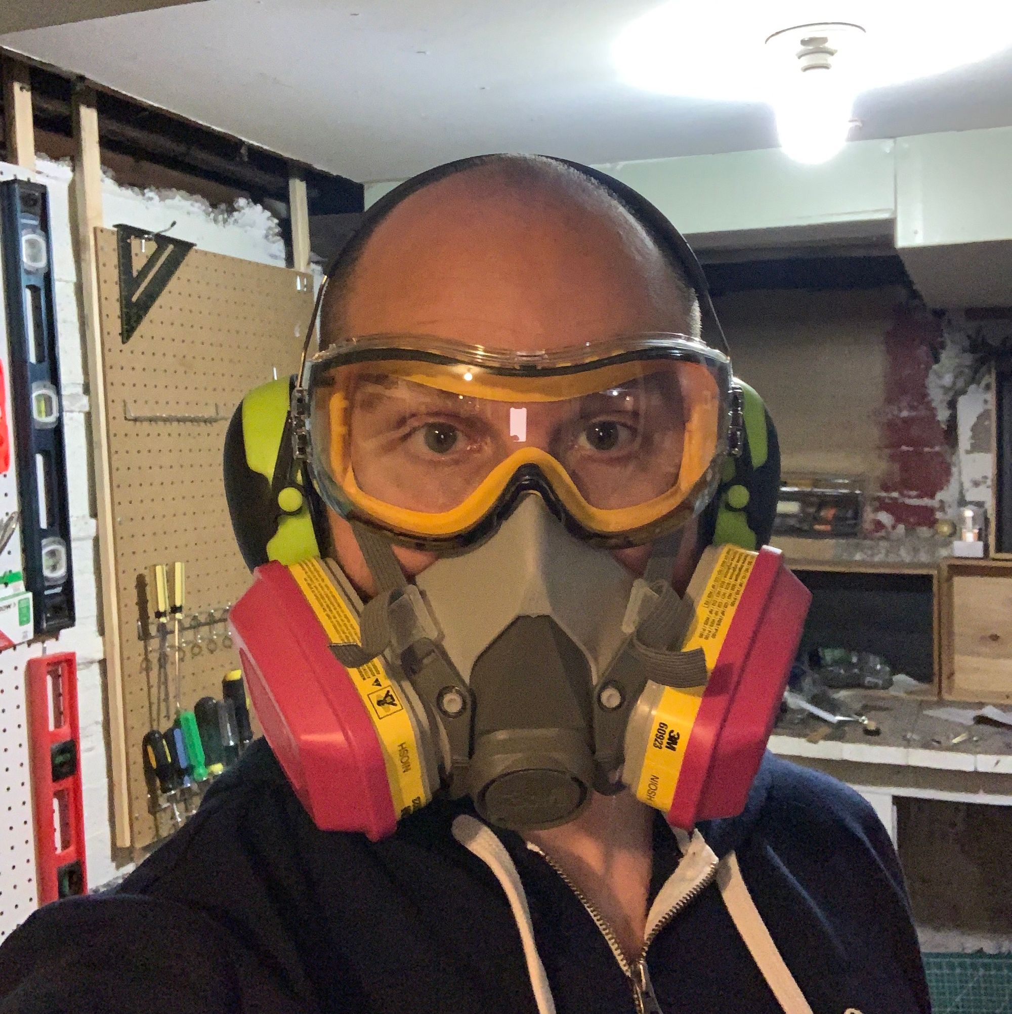 Me, wearing a respirator, as well as safety goggles and hearing protection