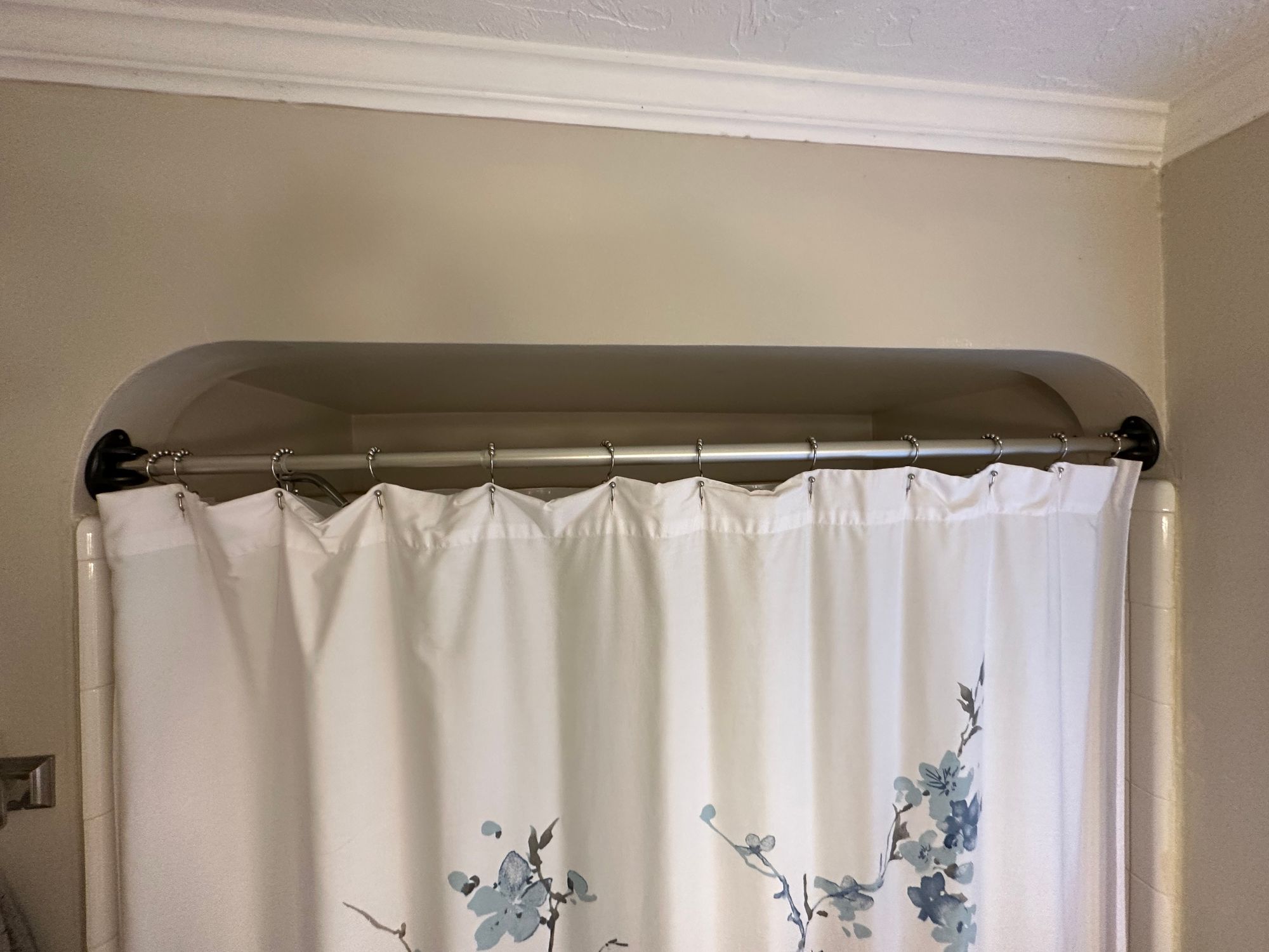 Shower curtain rod brackets